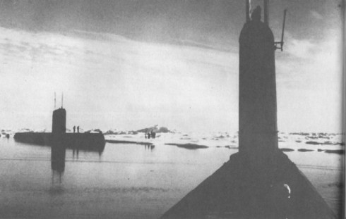 "Seadragon (SSN-584), foreground, and her sister Skate (SSN-578) during a rendezvous at the North Pole in August 1962. Note the men on the ice beyond the submarines"